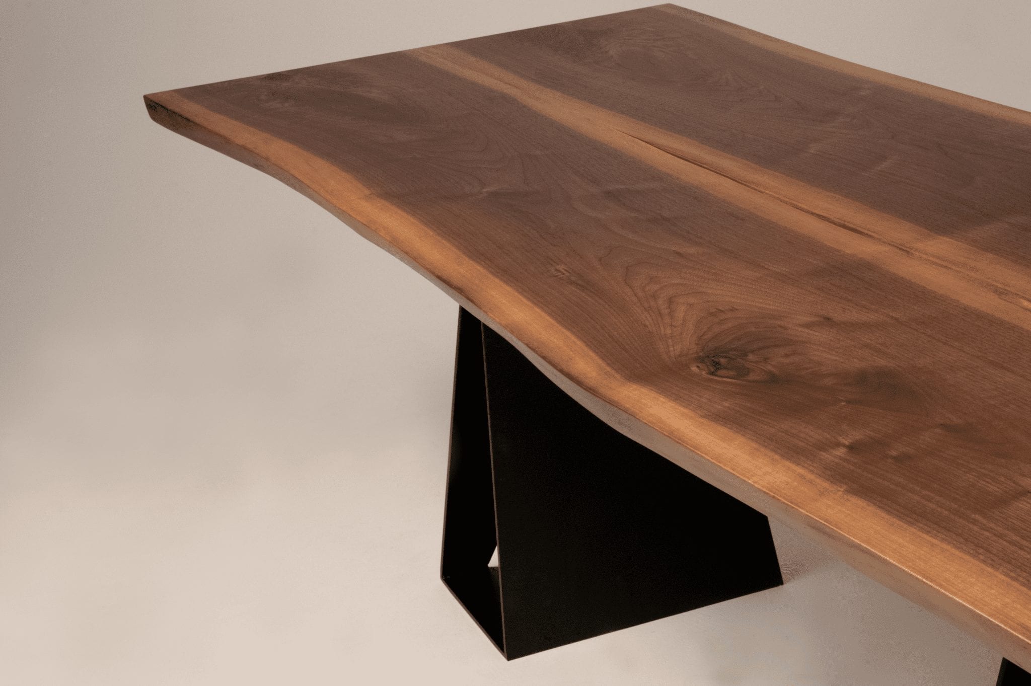 Solid black walnut dining table with modern design Handcrafted black walnut dining table with unique grain